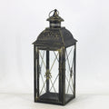 European-style wrought iron floor-standing storm lantern with tempered glass panels in black gold brush finish