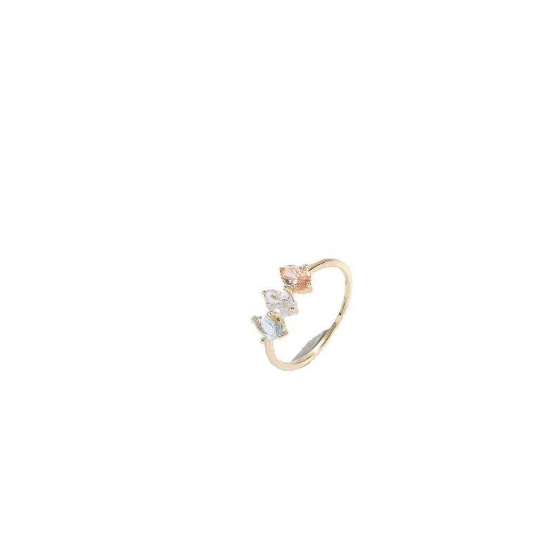 Gold electroplated geometric women's ring with triangular elements and horse eye tricolor zircon birthstone
