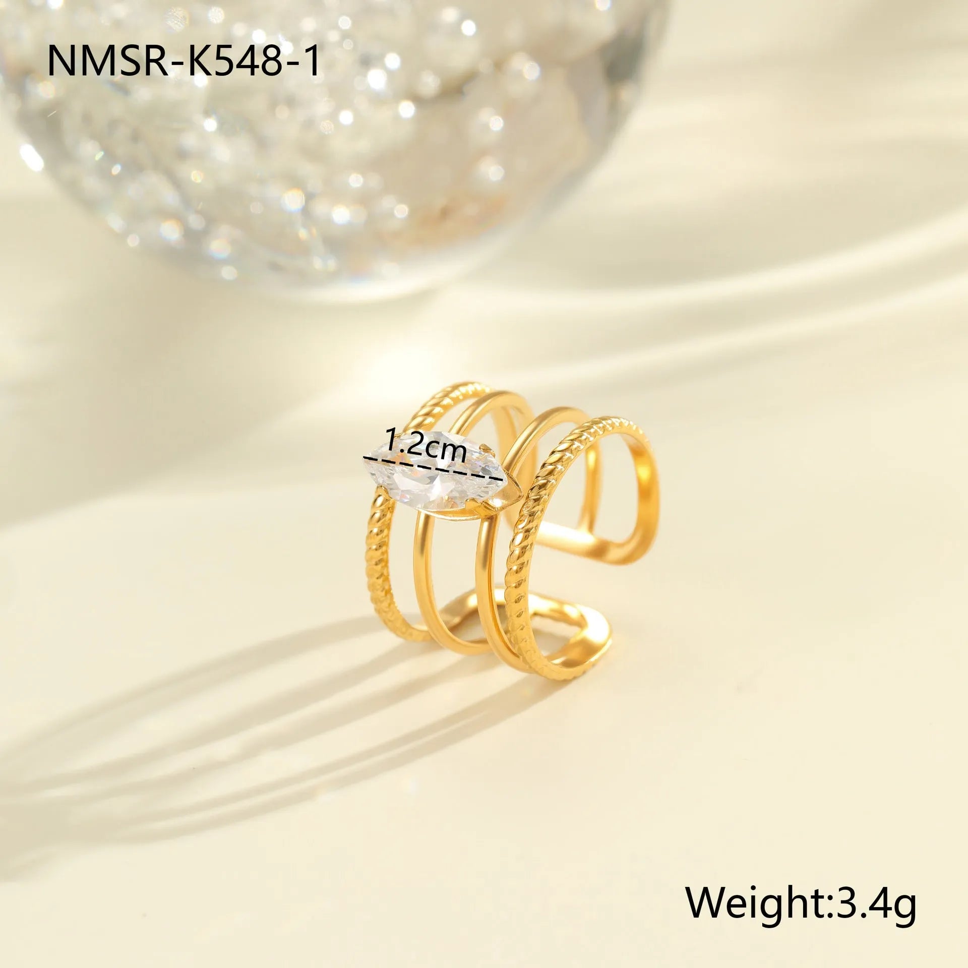 Gold-coloured stainless steel open ring with zircon stones in a geometric heart design.