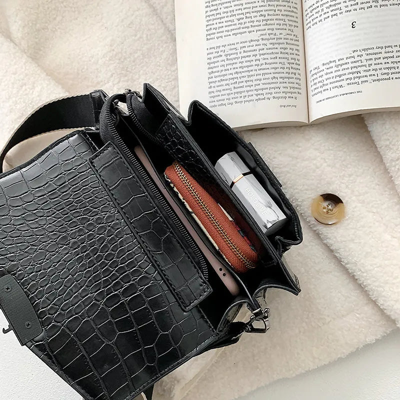 Vintage-style black PU leather crossbody bag with dimensions 20cm by 14cm by 7cm.