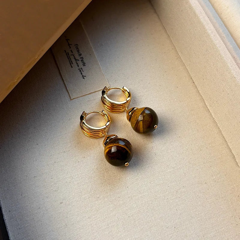 Tigereye geometric earrings with gold plating in brown or black colours featuring circular French retro design