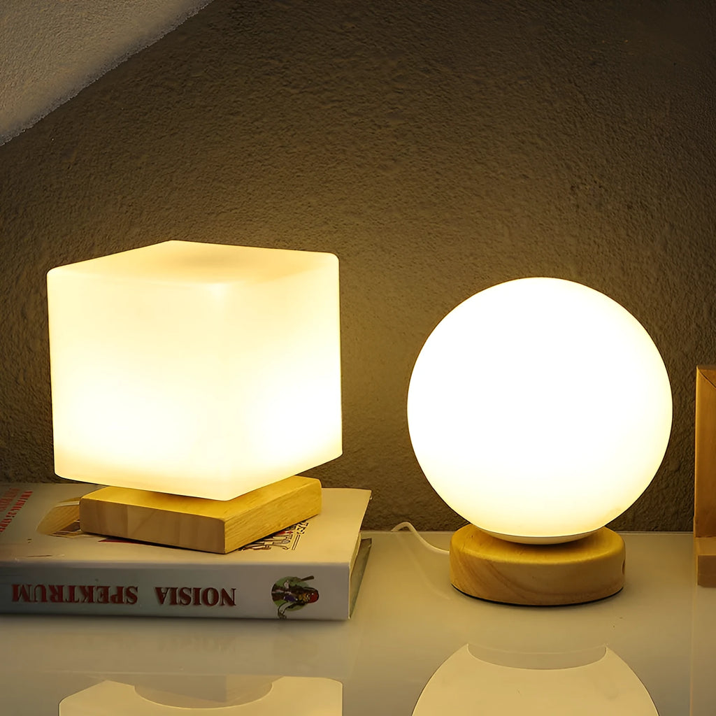 Nordic solid wood USB table lamp in a white geometric shape on a wooden surface.