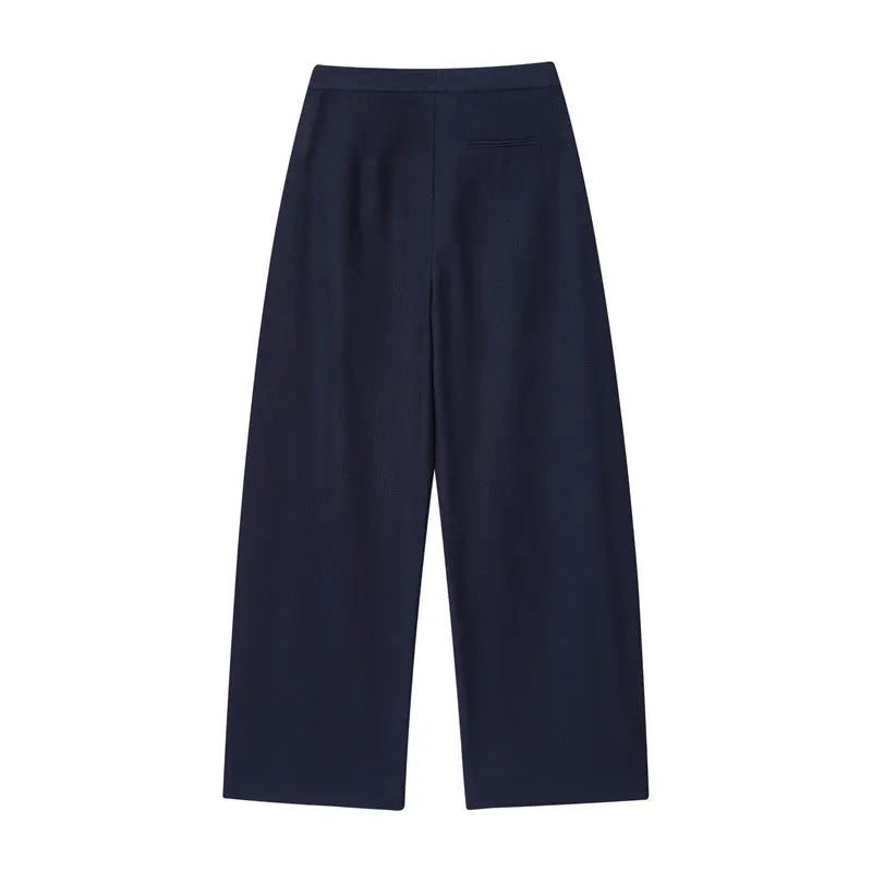 Women's linen blend co-ord set showing off-neck top with flounced sleeves and wide leg trousers.