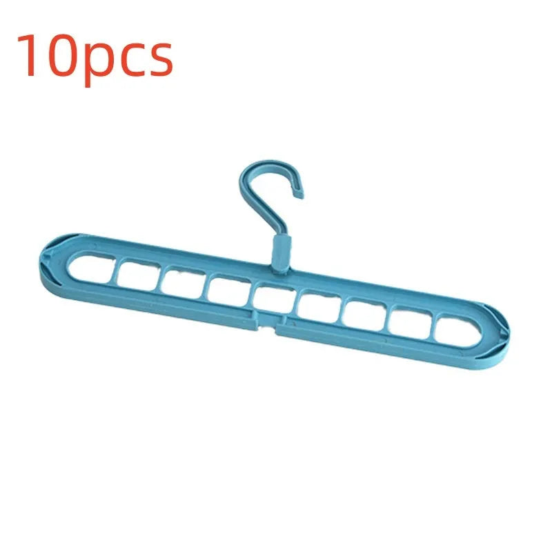 A green plastic multifunctional hanger with nine holes for trousers, shown in a folded and unfolded position.