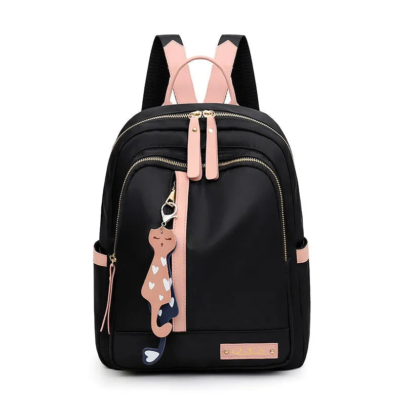 Women's black nylon casual backpack with double shoulder straps showing three-dimensional outer pockets