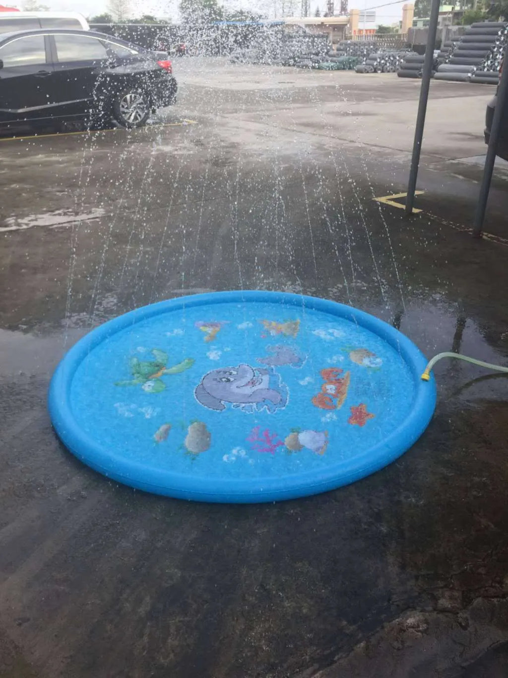 Blue PVC children's water spray mat with marine animal designs measuring 100cm by 170cm