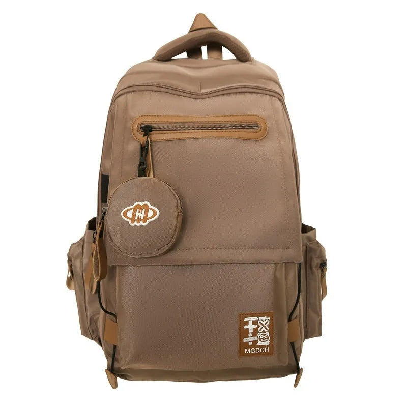 Large black nylon school backpack with curved shoulder straps for secondary school students.