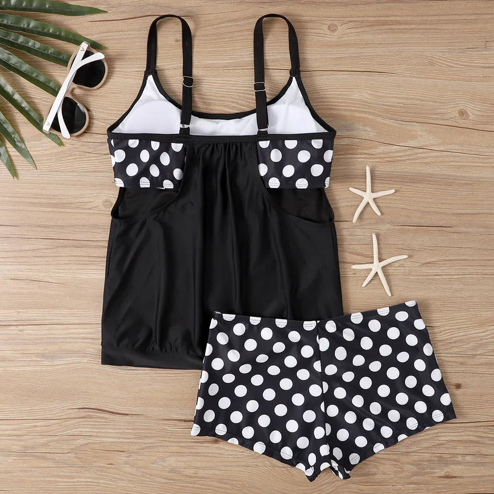 Black women's polka dot swimsuit with high-waist boxer brief bottoms.