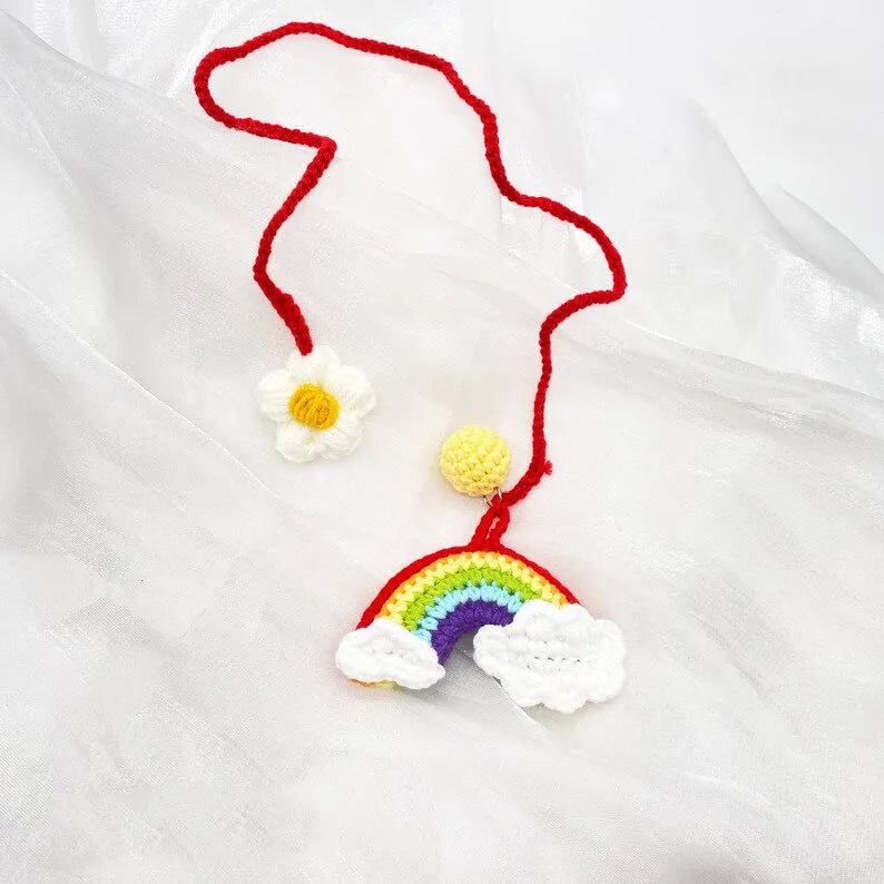 Handmade crocheted car pendant in avocado, pink rainbow, and red rainbow colour designs