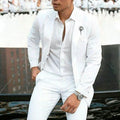 Men's white slim fit two-piece wedding suit with jacket and trousers on hanger