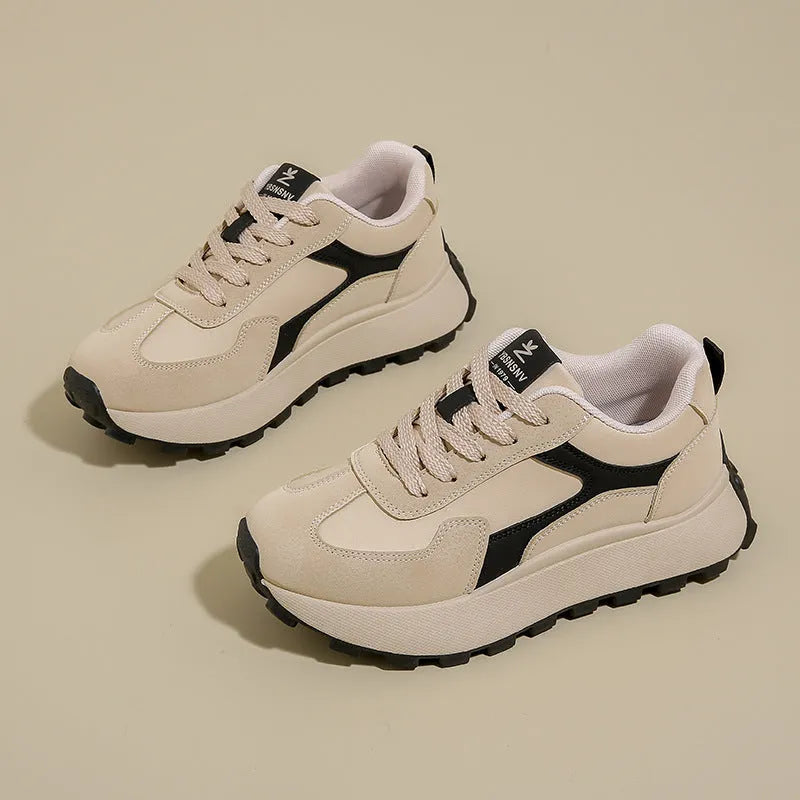 Women's low-top platform sports shoes in solid colours with lace-up front and mesh lining.