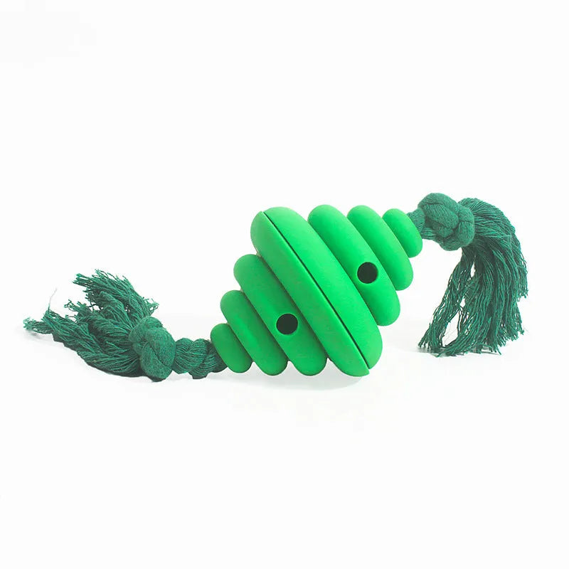 Green and yellow silicone dog ball with rope handle for tug-of-war and treat dispensing