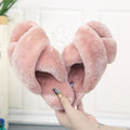 Women's black cross open-toe fur slippers with a patterned anti-slip sole.