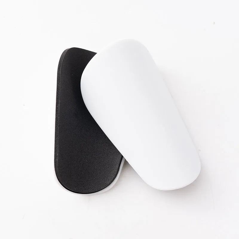 PU mini shin guards for football and sports protection in black, white, red and blue colours