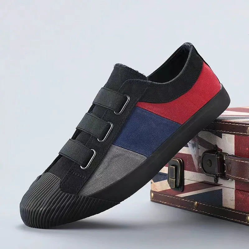Men's beige canvas low-top sneakers with elastic band fastening and a vulcanised rubber sole.