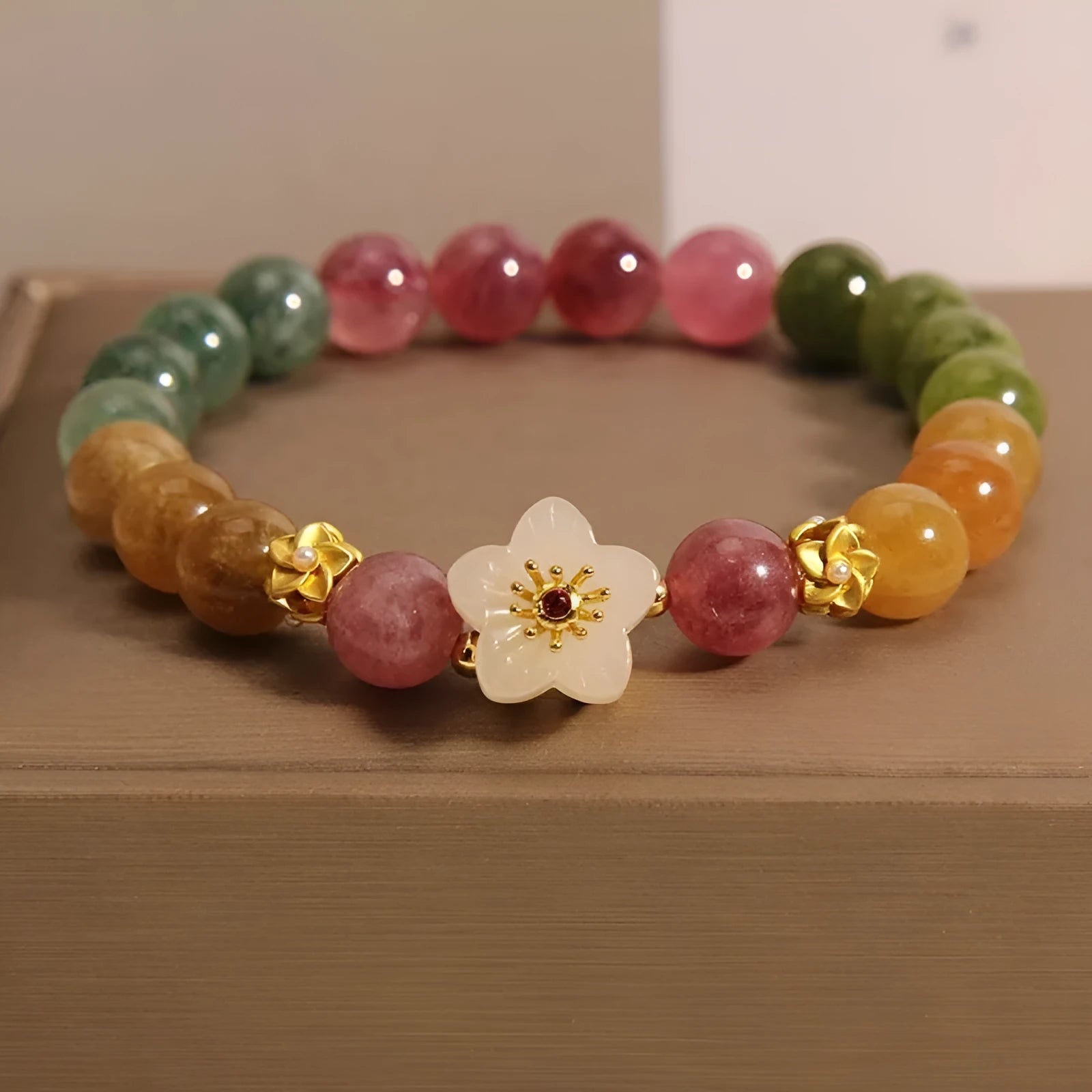 Natural colour tourmaline bracelet with electroplating in flower or fu character geometric design