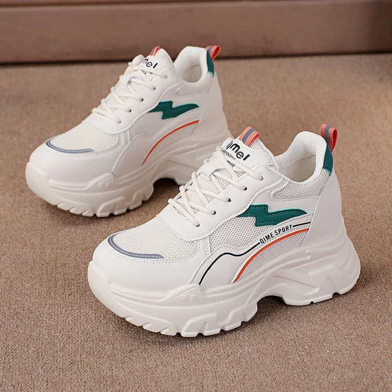 White women's dad shoes with cross shoulder straps, breathable mesh, and a rubber sole.