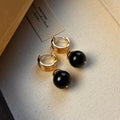Tigereye geometric earrings with gold plating in brown or black colours featuring circular French retro design