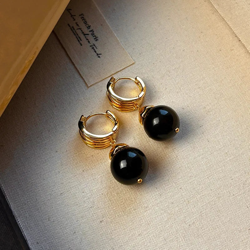 Tigereye geometric earrings with gold plating in brown or black colours featuring circular French retro design