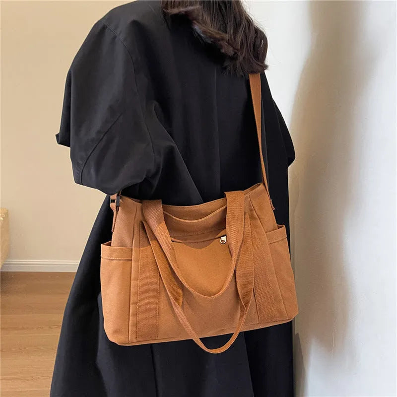 Women's polyester canvas shoulder bag with large capacity and mobile phone pocket in solid colour