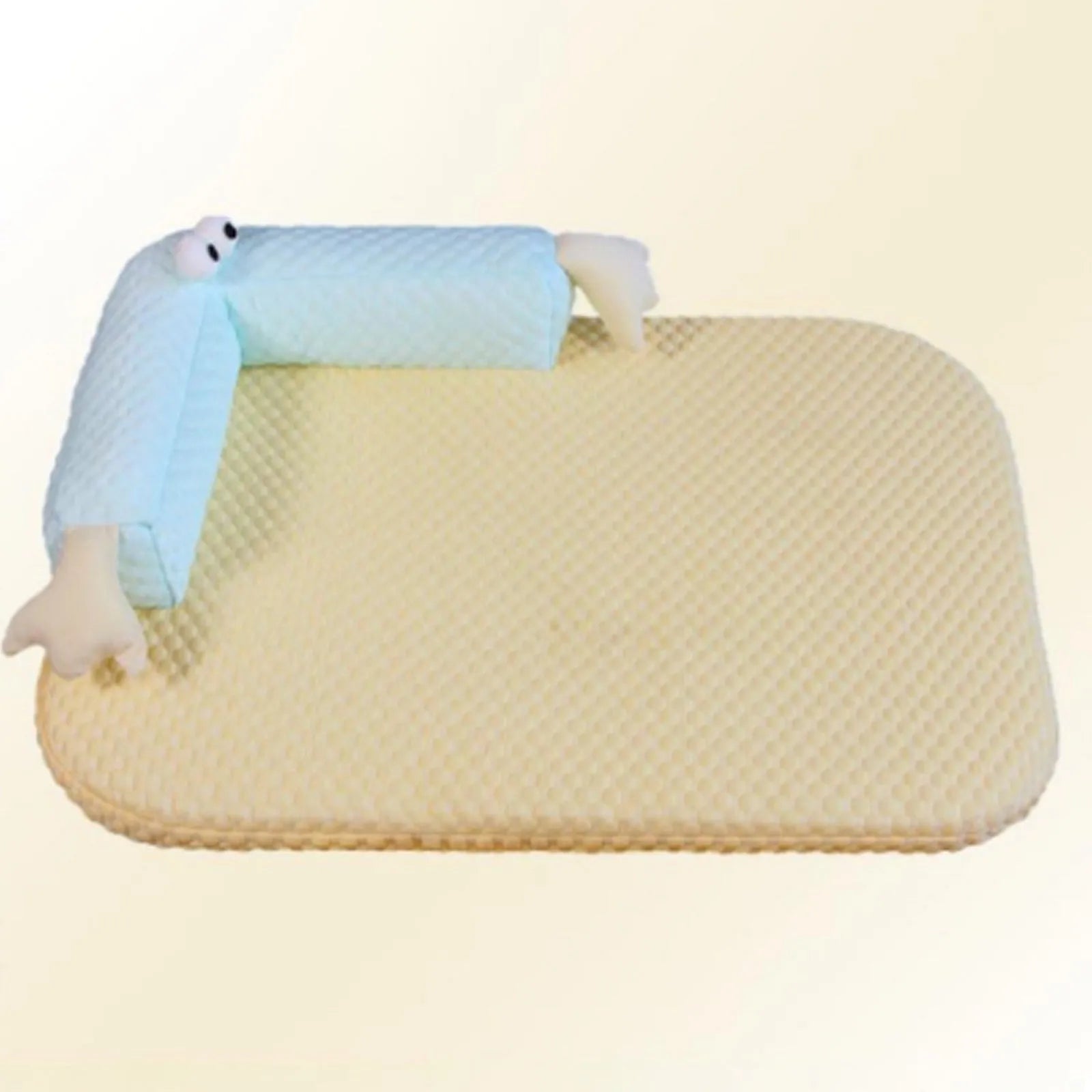 Blue polyester pet bed cushion with printed big-eyed monster face design, shown on a wooden floor.