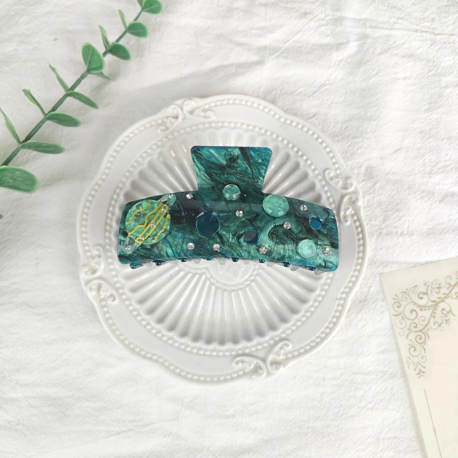 Oversized women's barrette with a starry sky design in blue, made from cellulose acetate sheet.
