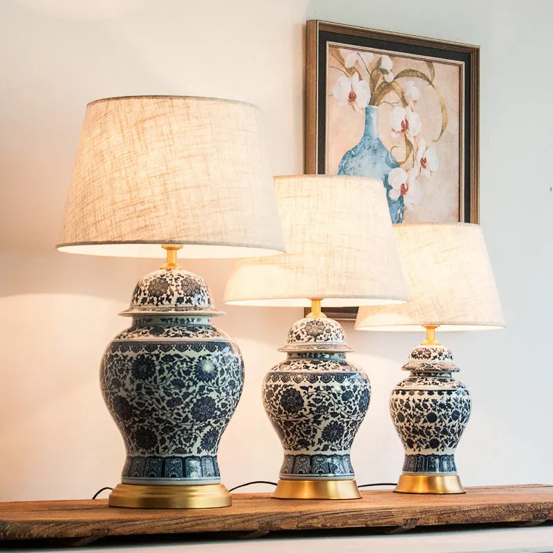 Chinese blue and white porcelain table lamp with copper base and cloth shade