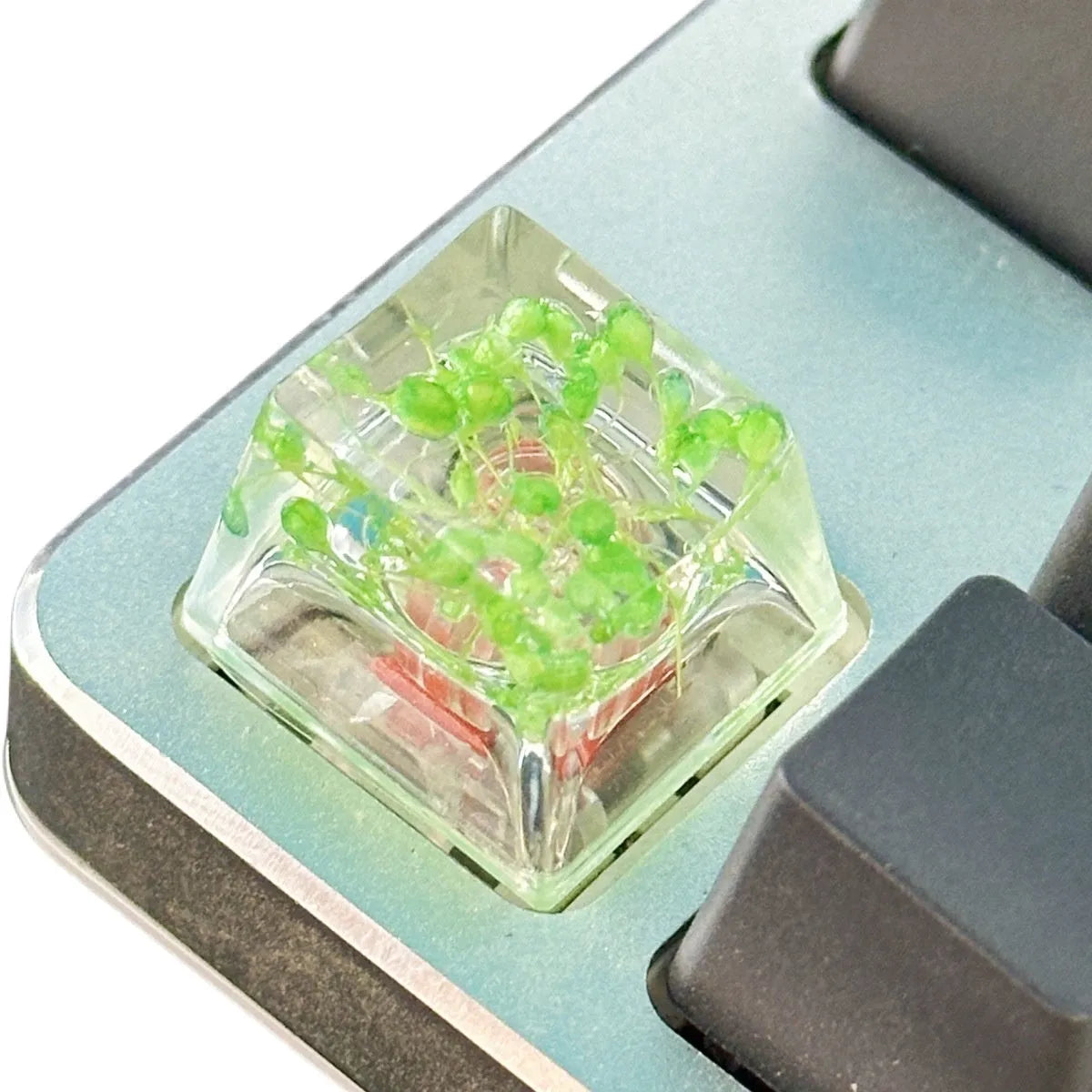 Resin starry sky artisan keycap in green, pink, red, or violet for mechanical keyboard customisation.