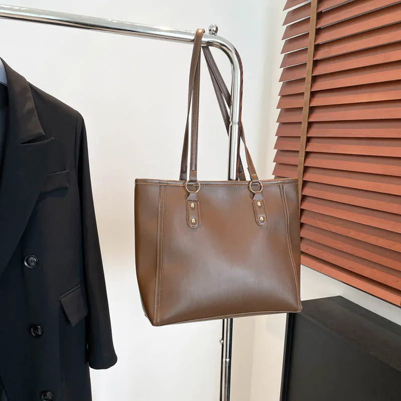 Korean style shoulder underarm bag in black PU leather with horizontal square shape and sandwich pockets