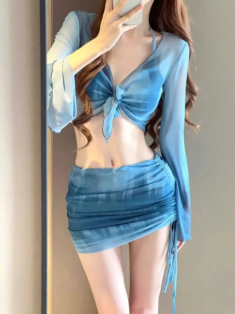 Women's four-piece high waist bikini set in blue and pink with skirt and backless top