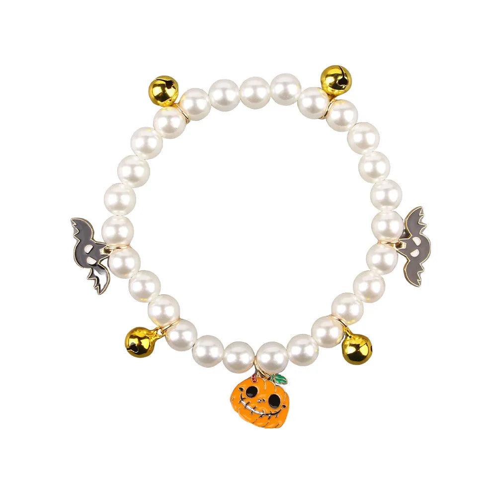 Purple simulated pearl Halloween cat collar decoration with a choice of ghost or pumpkin pendants.