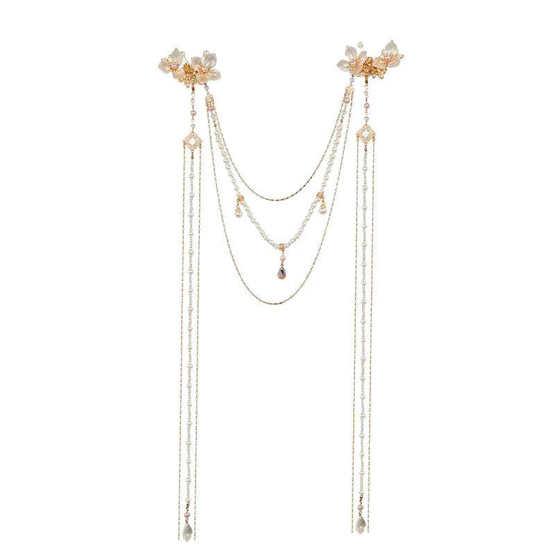 Women's hairpin with pearl, diamond and flower design featuring long tassel detail and gold-coloured grip