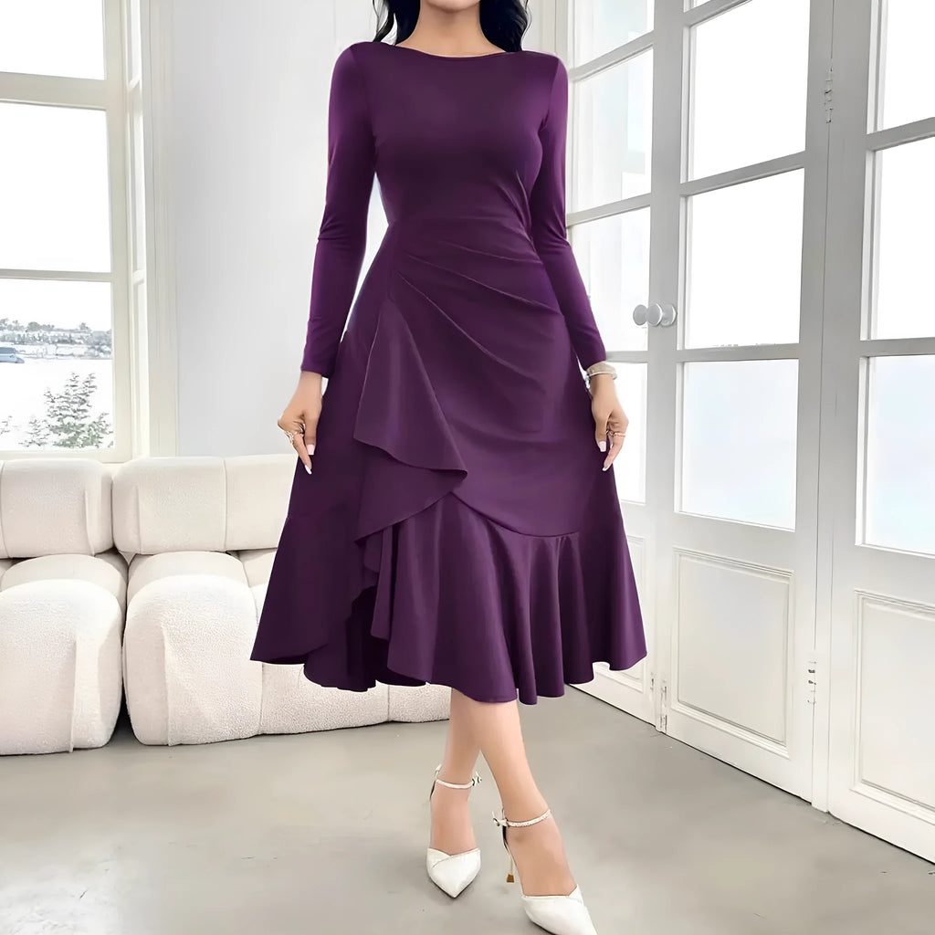 Purple women's dress with long sleeves, round neck, and ruffle detailing.