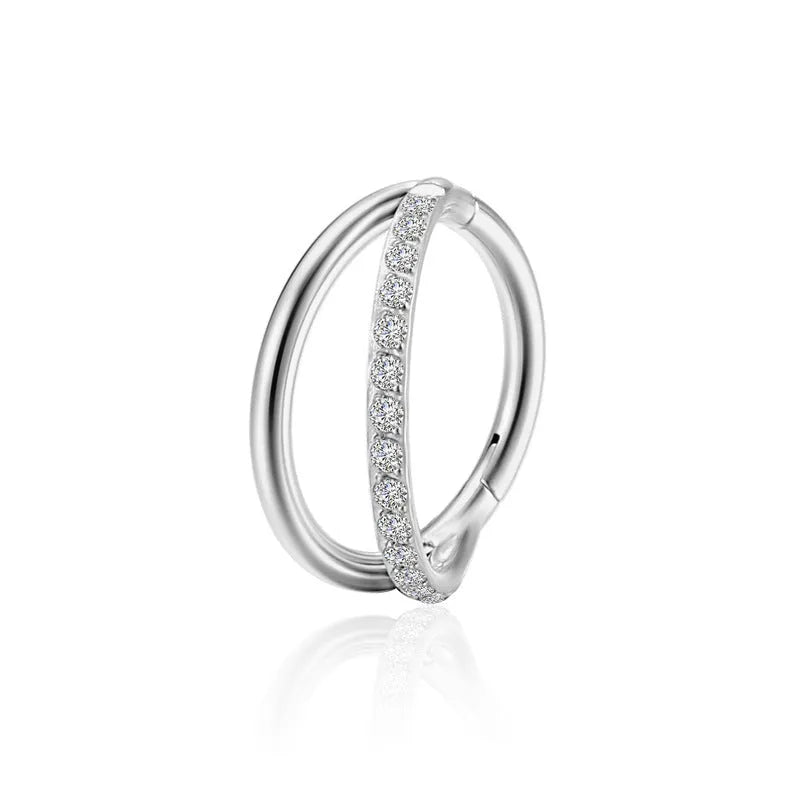 Titanium alloy fork nose ring for body piercing in silver colour on a grey background.