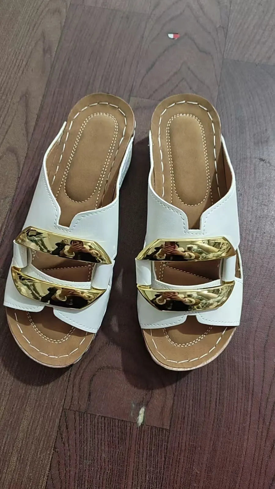 Adult Roman style platform sandals in a solid colour with a strap design and flat rubber sole.