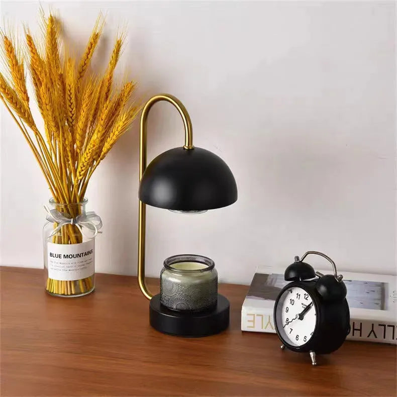 Solid wood base aromatherapy lamp with metal shade on a bedside table, with a wax melt dish.