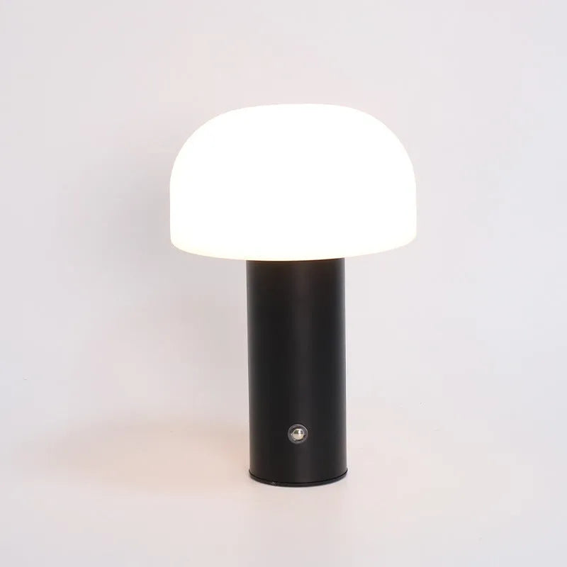 USB-powered dual-purpose table lamp providing atmospheric lighting and charging in black, green, orange, or white
