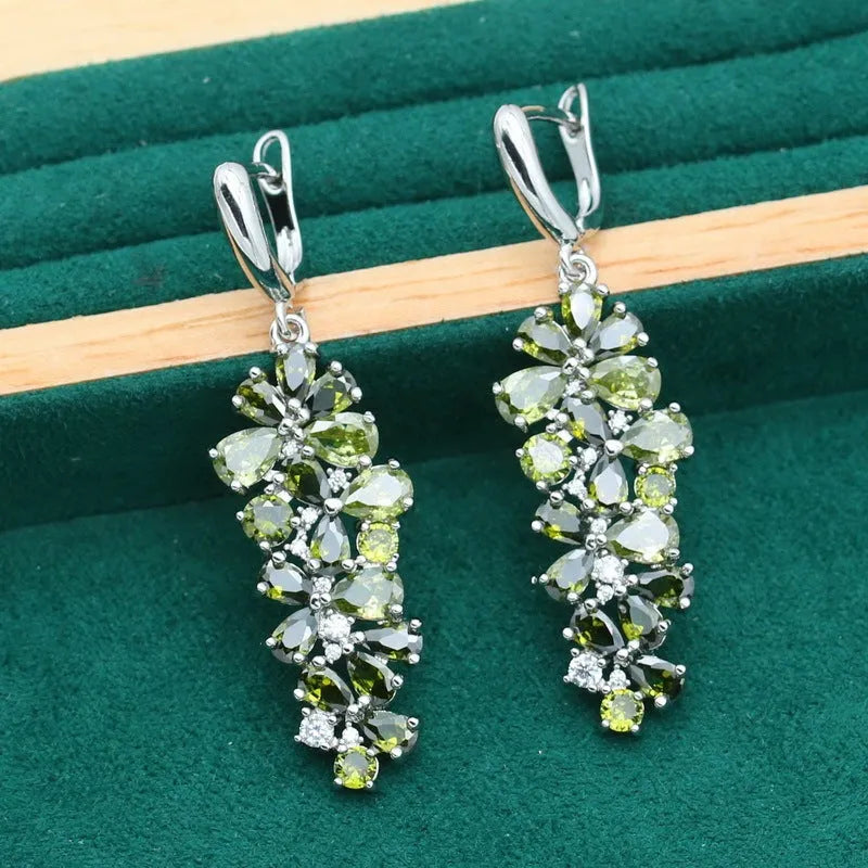 Complete retro floral jewellery set in copper with zircon stones, showing necklace, bracelet, earrings, and ring in olive green finish.