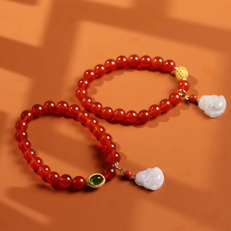 Handmade women's bracelet with red agate and amber Maitreya Buddha pendant.