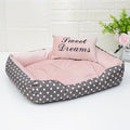 Square polka dot print dog bed with raised sides and a matching embroidery pillow for small dogs.