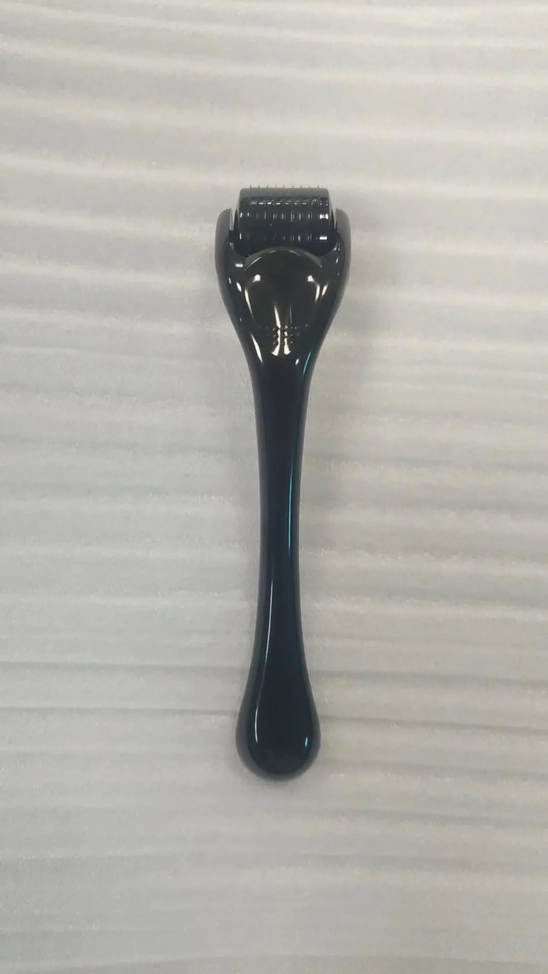 540 micro needle derma roller showing handle and needle wheel in a selected colour