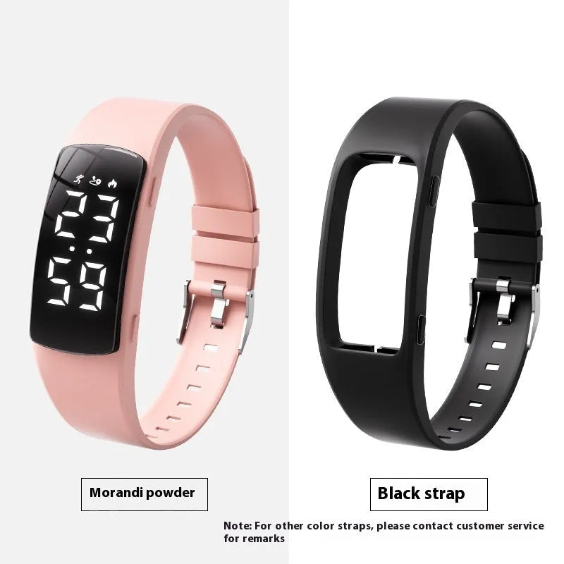 Black vibration alarm smart watch with LED display and silicone strap on a wrist.