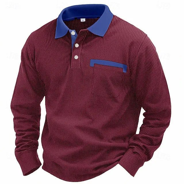 Man modelling a loose-fit long sleeve polo shirt with a waffle-texture fabric in a solid colour.