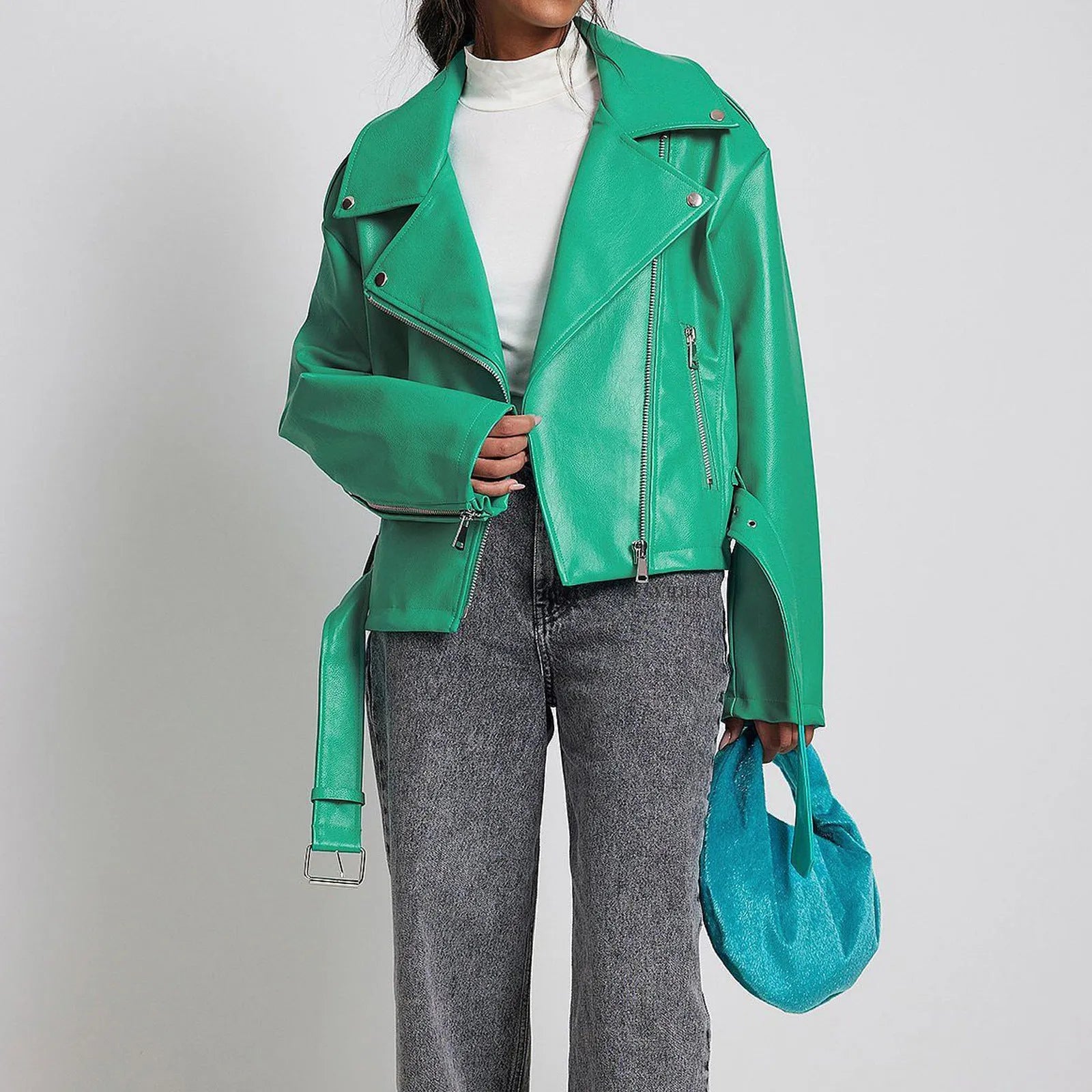 Black punk-style locomotive jacket with a drawstring waist, Peter Pan collar, and regular sleeves on a hanger.