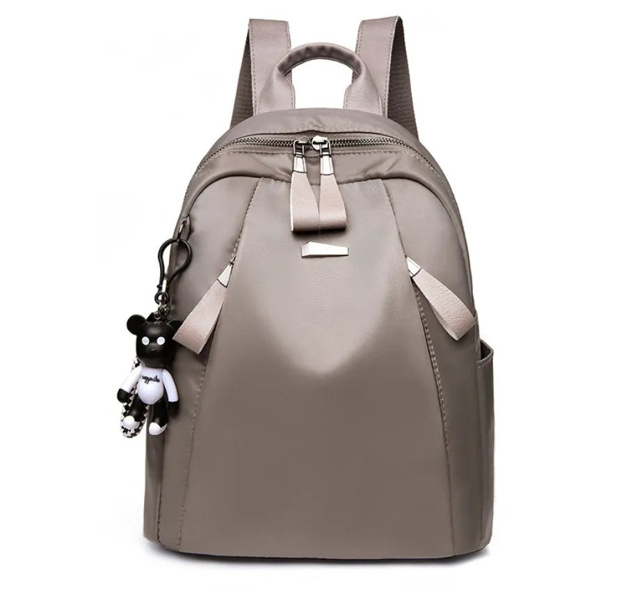Medium Oxford cloth rucksack showing internal phone and ID compartments with dual straps