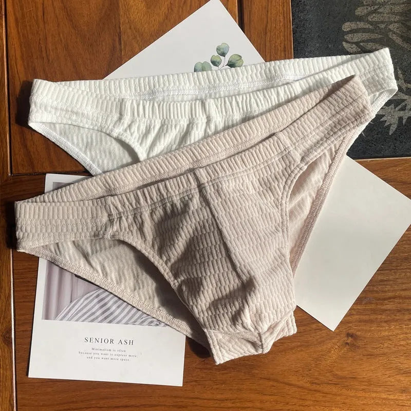 Men's solid colour cotton triangle underwear briefs in mid-waist design on a white background