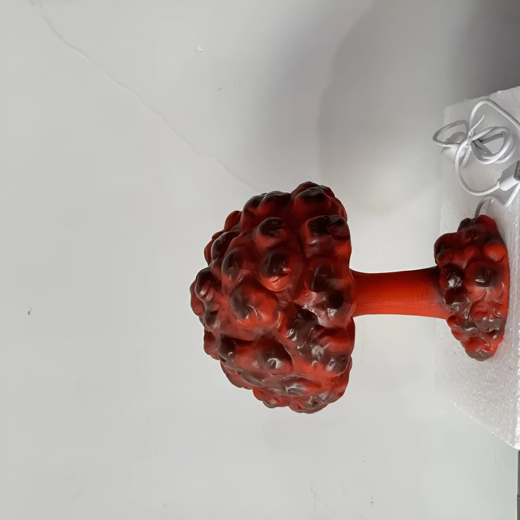 Modern art table lamp shaped like an atomic bomb mushroom cloud explosion on a table.