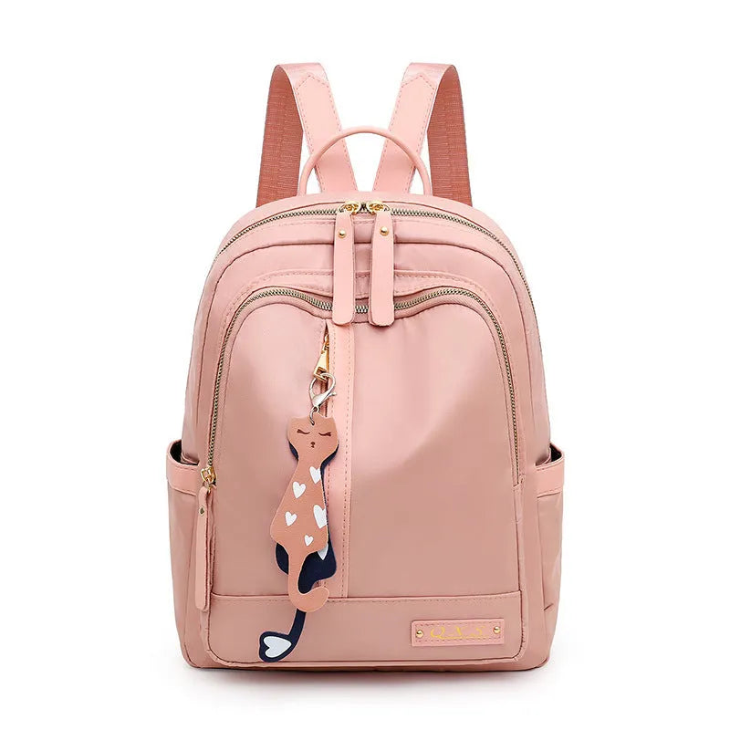 Women's black nylon casual backpack with double shoulder straps showing three-dimensional outer pockets