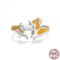 Silver ring with a raised cartoon corgi dog design, electroplated finish.