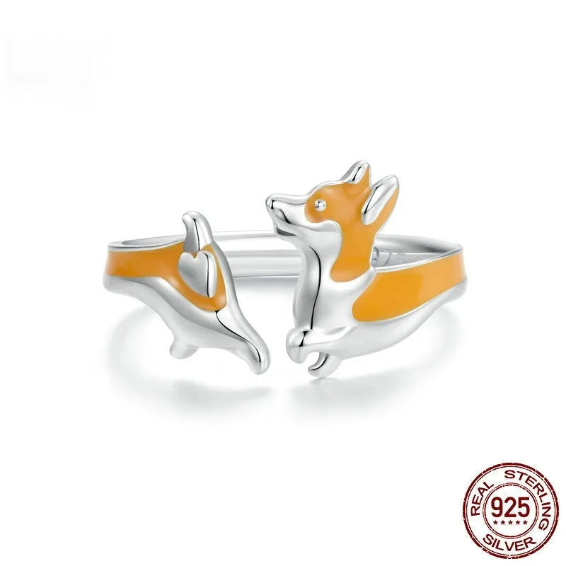 Silver ring with a raised cartoon corgi dog design, electroplated finish.